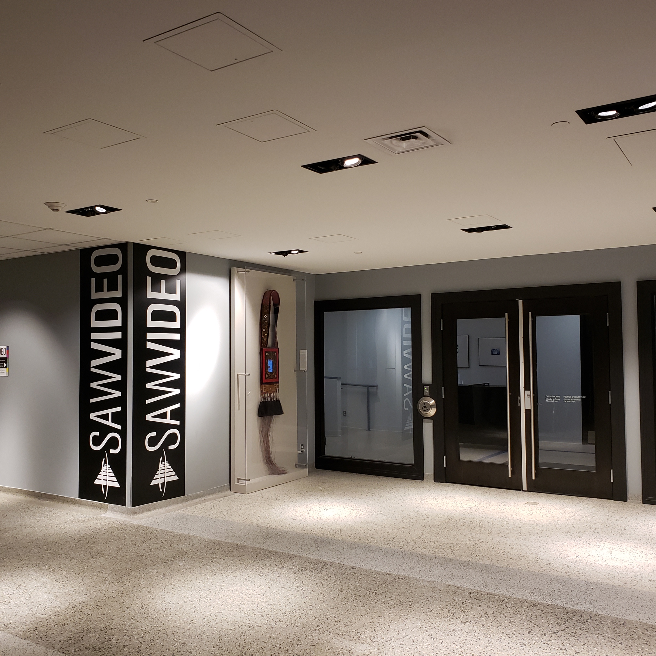 lobby outside SAW Video main office logo and public artwork by Barry Ace